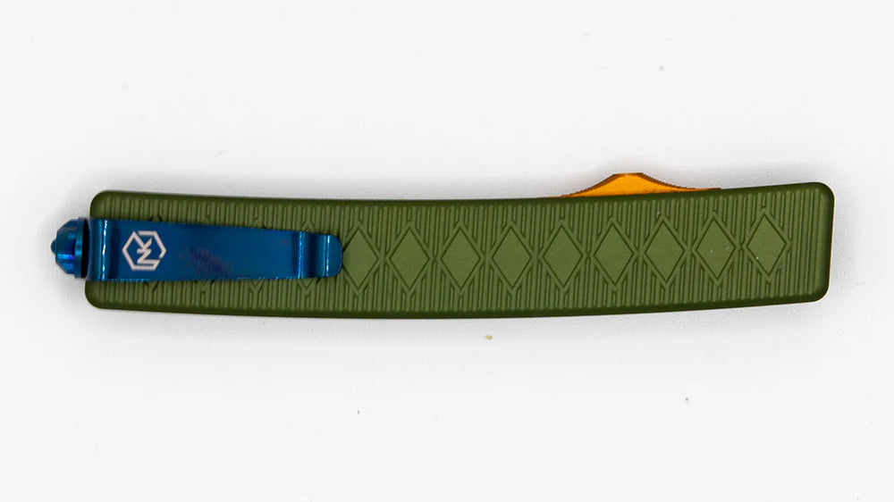 Shogun knife with stunning patterned green aluminum handle, orange deployment switch, and blue tactical belt clip.