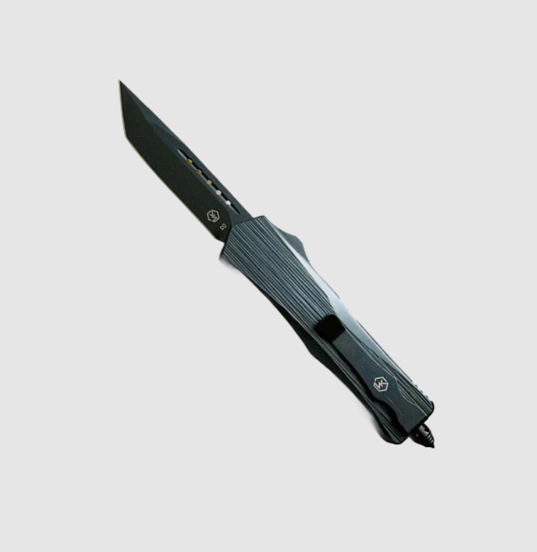 A tactical folding pocket knife with a matte black finish, shown open against a light gray background.