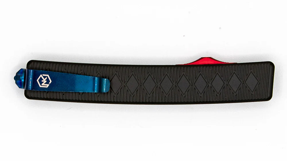 Shogun knife with stunning patterned black aluminum handle, red deployment switch, and blue tactical belt clip.