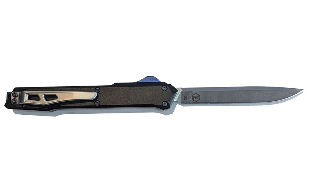 Out-the-front OTF knife with a steel blade and black handle with blue deployment switch and silver belt clip on a white background