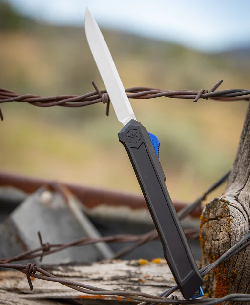 Out-the-front OTF knife with a black handle and blue accent on barbed wire